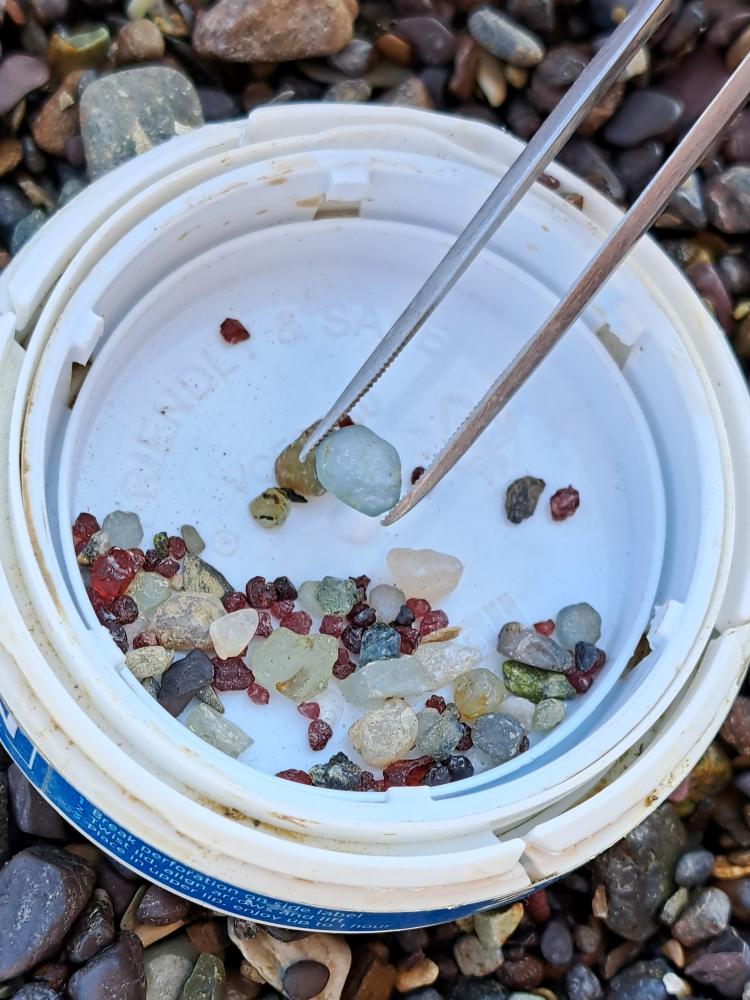 Larger sapphire crystal among gravels in Eldorado